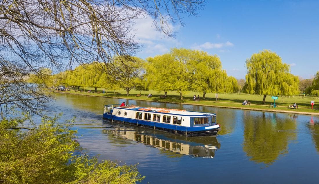 The Rita Ellen cruising the Avon past the willows